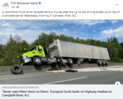 Truck Climbed Concrete Barrier.