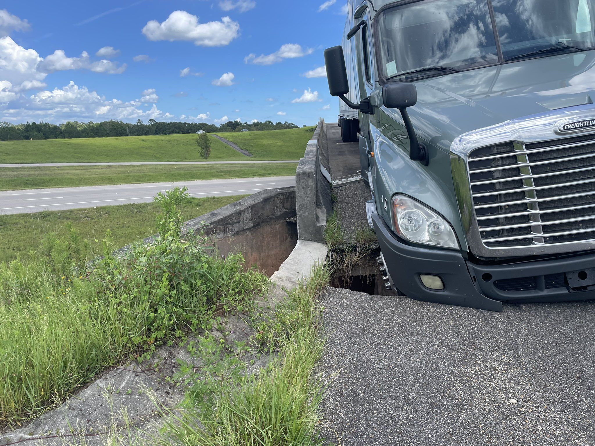 Mississippi Road Collapses Under Semi Truck Drivers USA   MHP Bioxi Road Collapse 