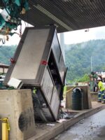 Toll Booth Attendant Trapped After Oversized Truck Hits Booth