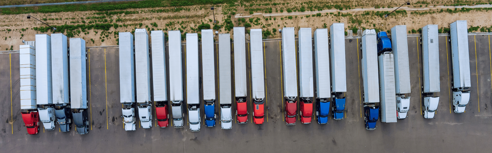 semi trucks parked in a row