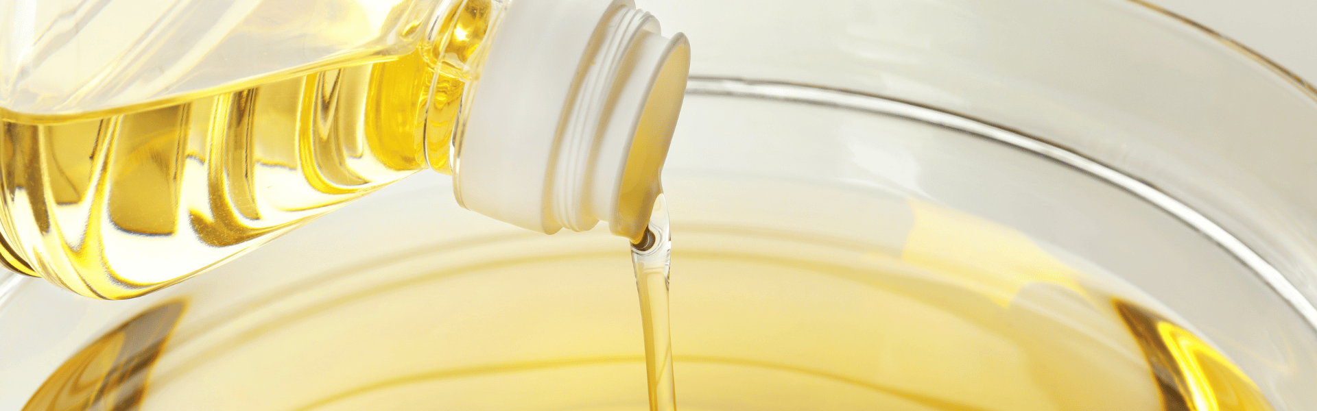 Vegetable oil pouring into bowl