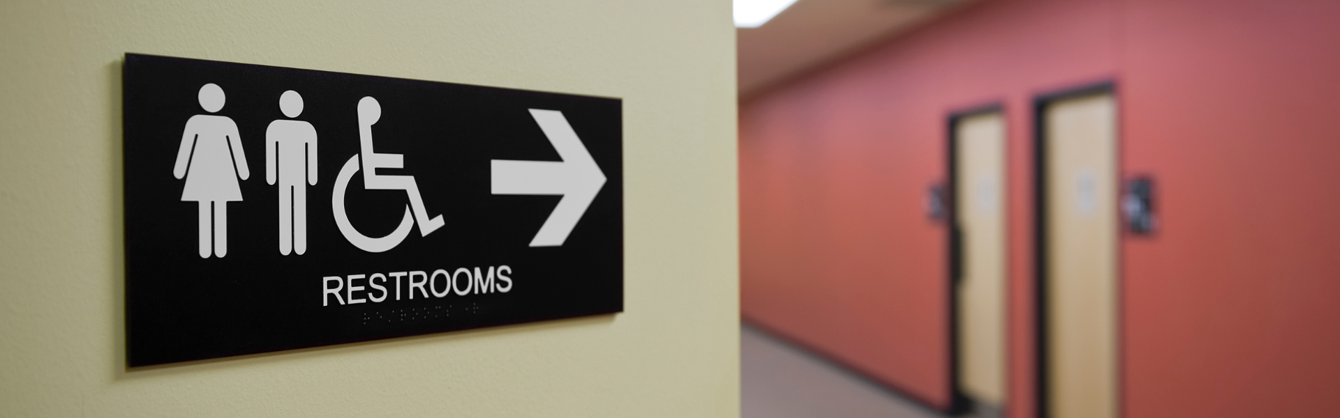 Sign pointing to restrooms