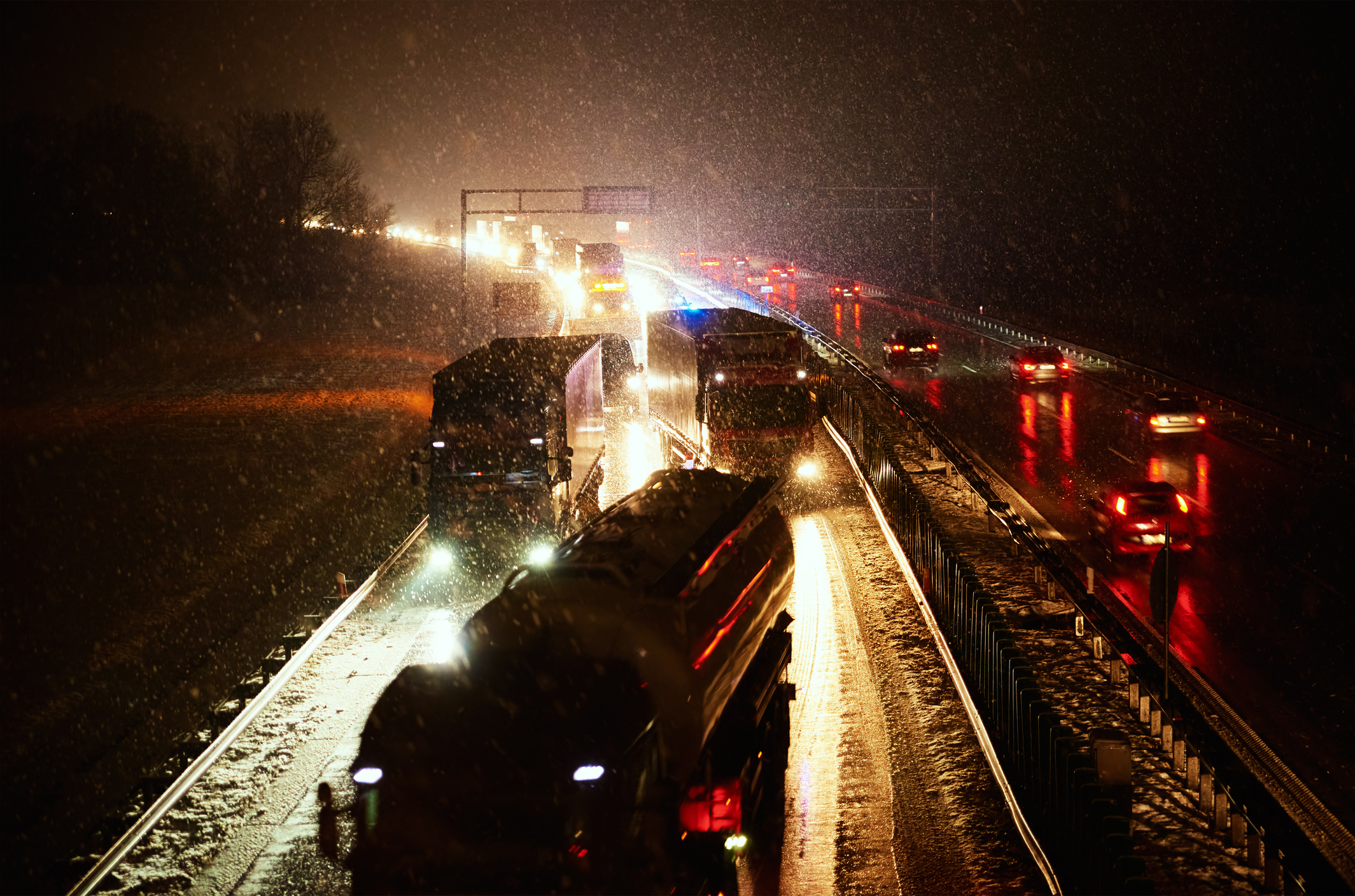 Car accident on slippery road at night during snowfall