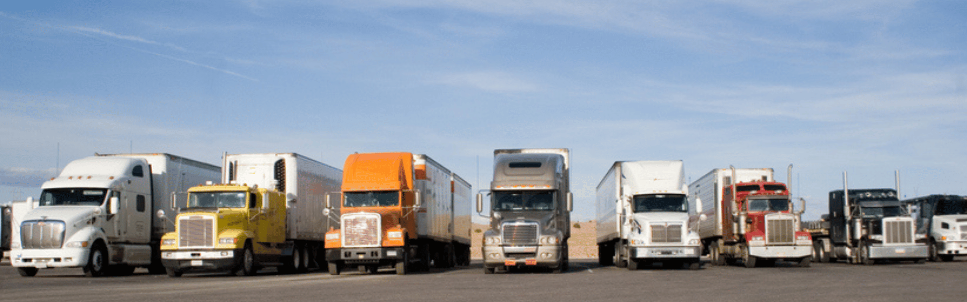 line of semi trucks parked