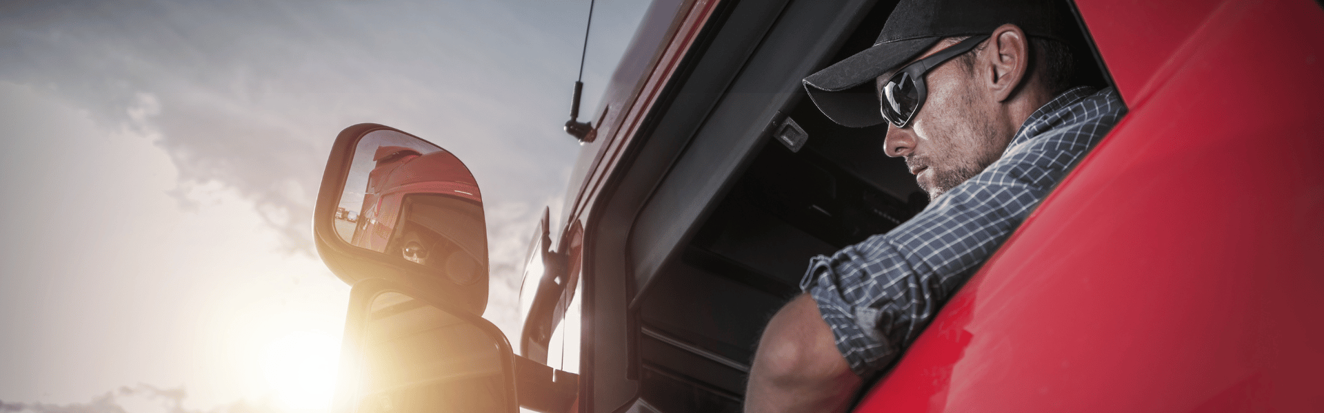 trucker in truck with arm out window