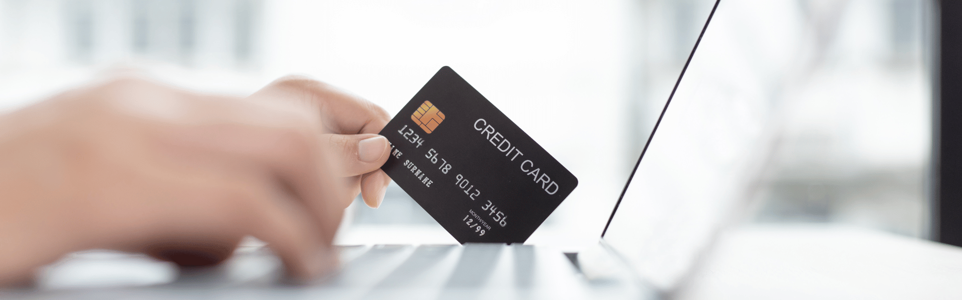 Online shopping with credit card and laptop