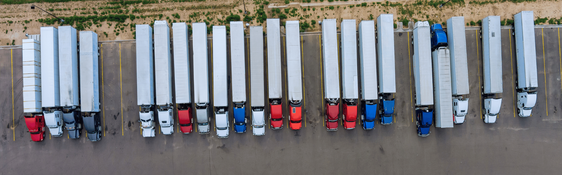 line of several parked semi trucks