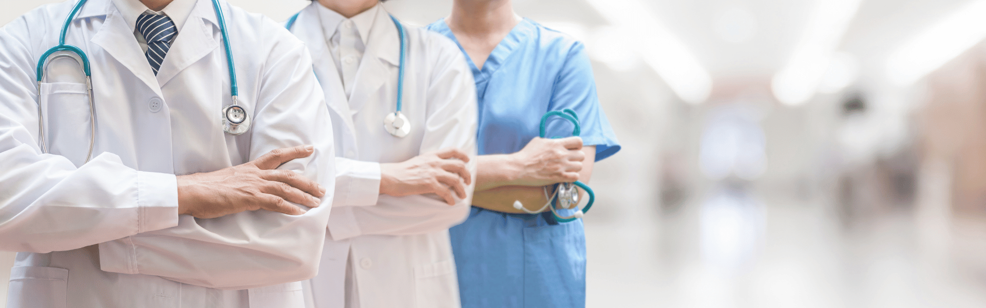 Doctors with crossed arms and stethoscopes