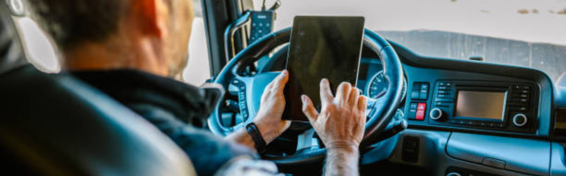 truck driver looking at tablet