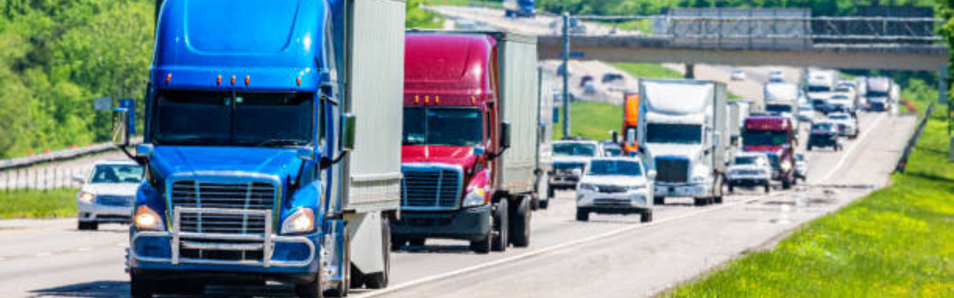 semi cars and passenger vehicles on highway