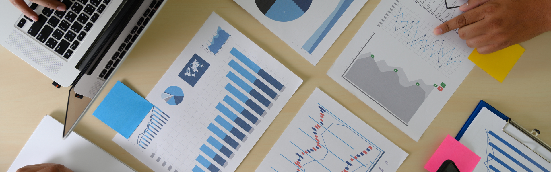 Research, charts and information spread out on desk