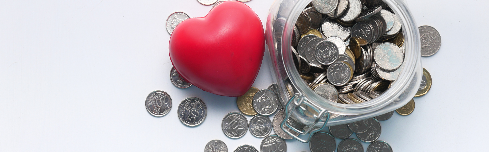 heart next to jar of coins