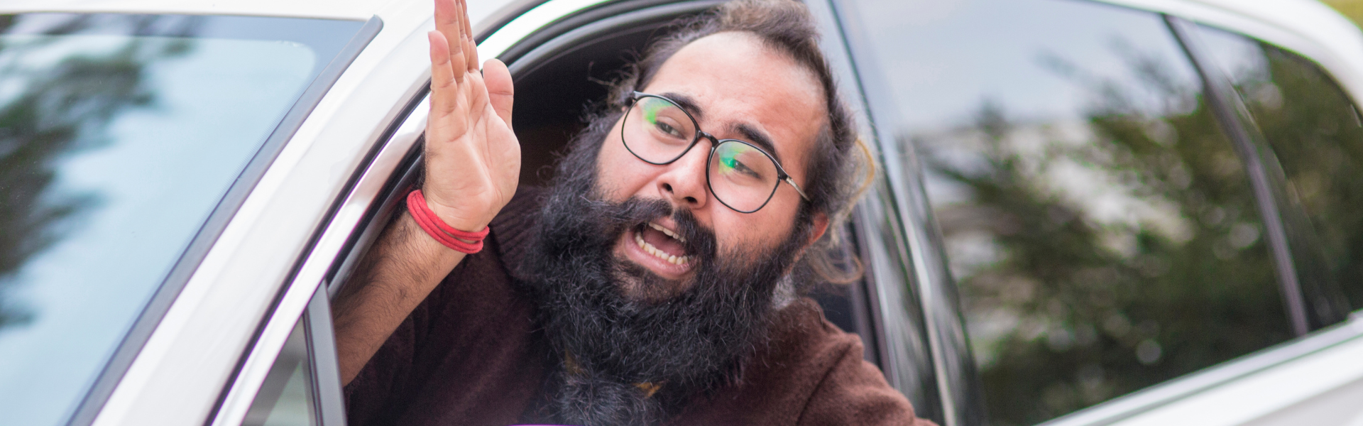 road rage man leaning out of car