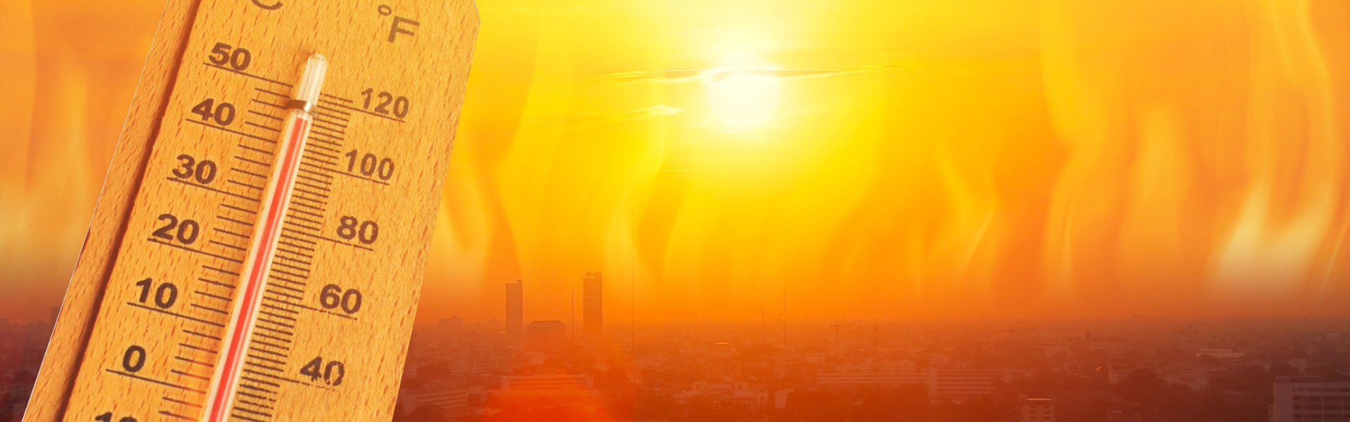 thermometer reading high temp with orange sunny background