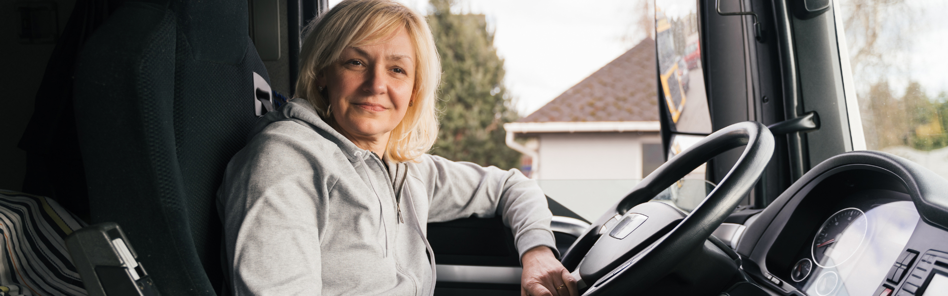 woman in cab of semi truck