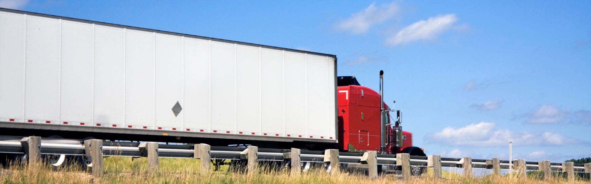 red semi truck on road