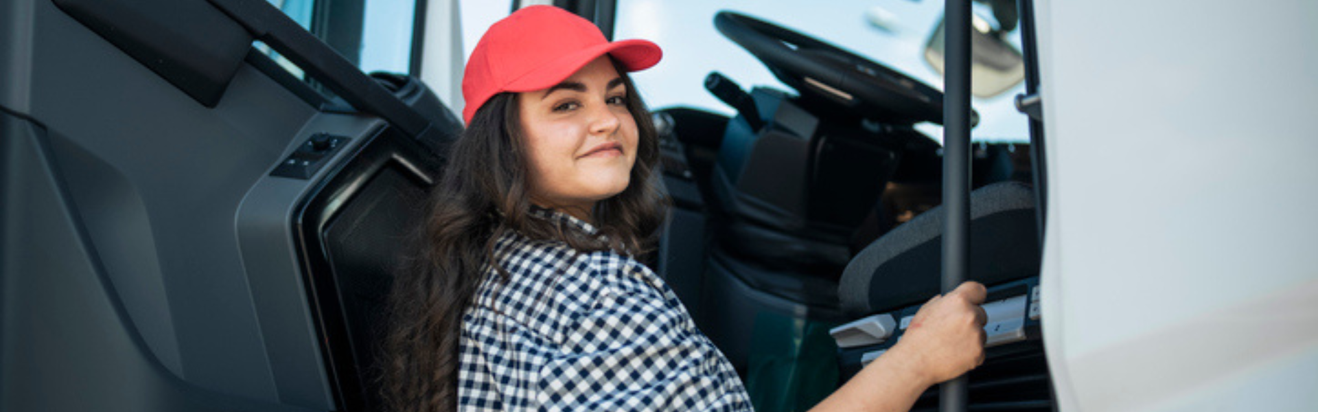 Woman getting into cab of semi truck