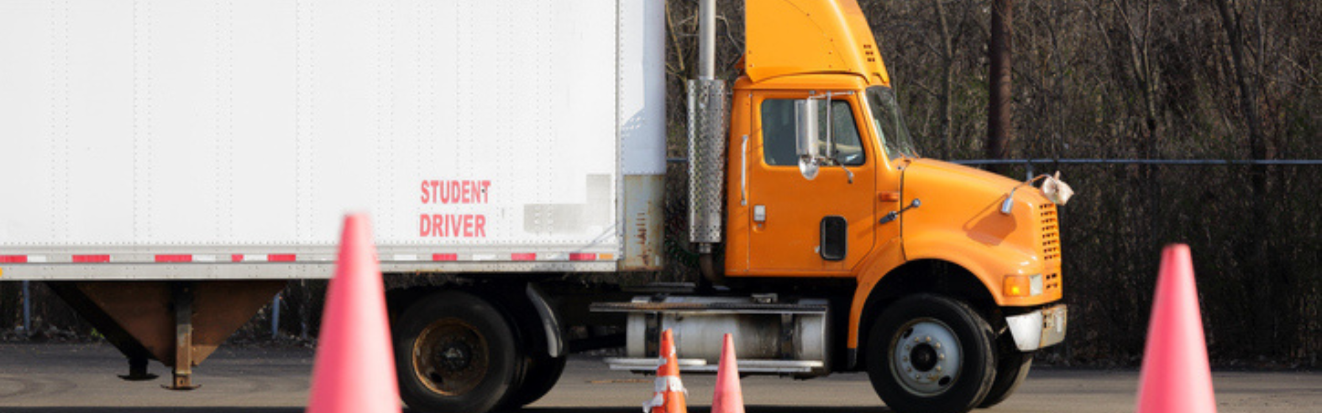 orange student driver semi truck