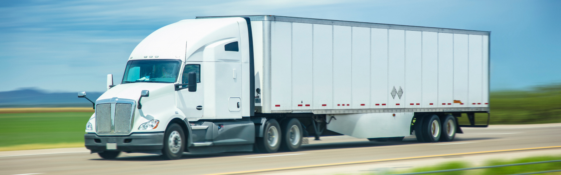 white semi truck on road