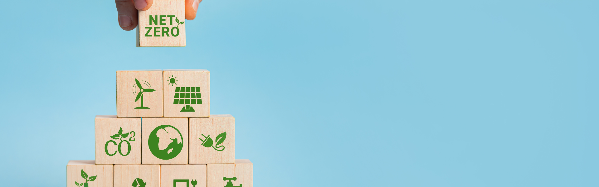 stacking blocks with green messaging, leading to net zero