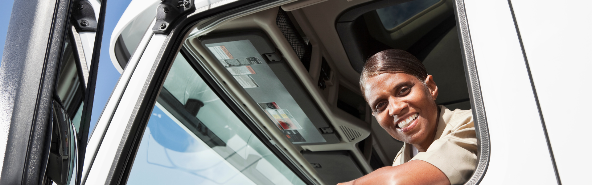 black woman driving semi truck