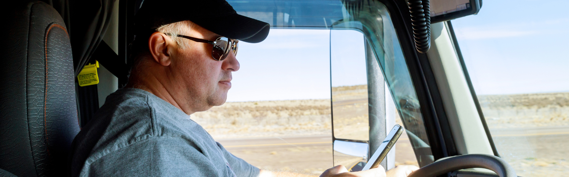 truck driver looking at phone