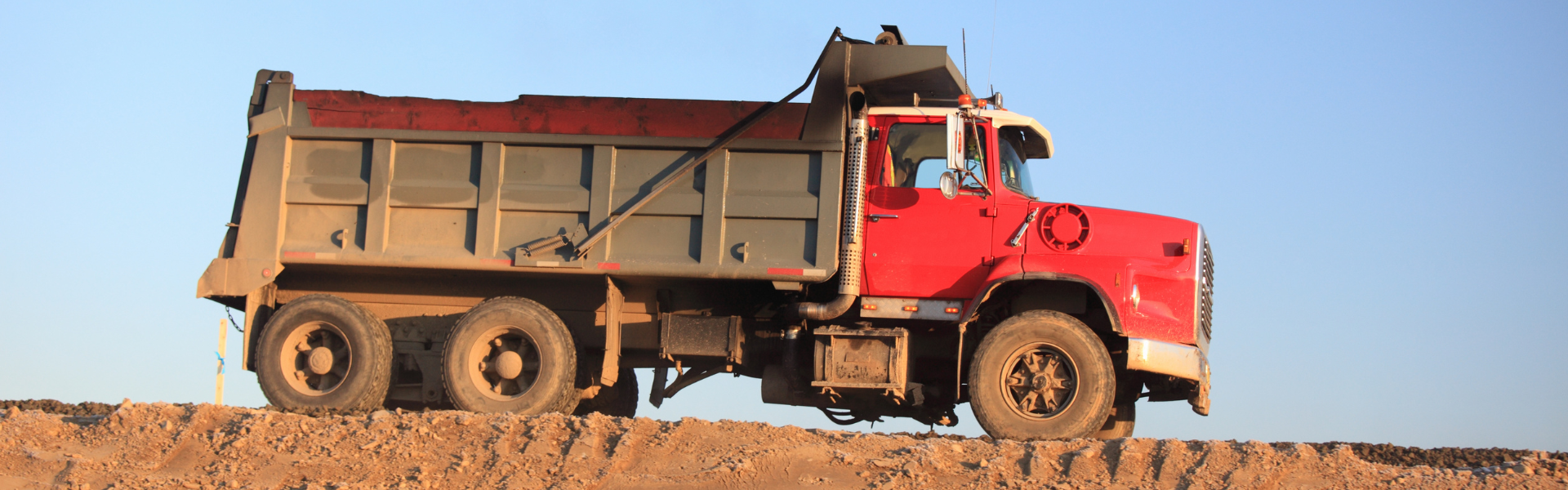 red dump truck on job site