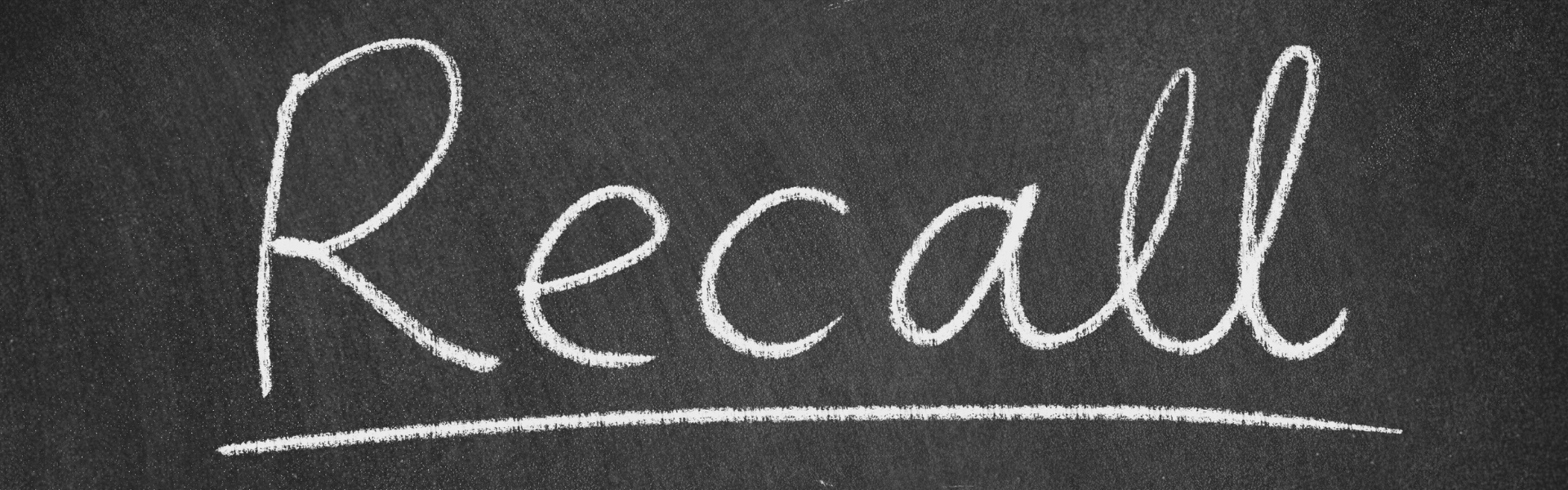 the word recall written in chalk on a blackboard