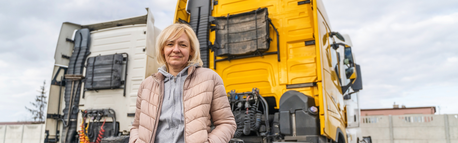 woman with yellow semi truck