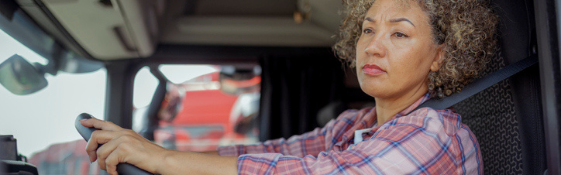 black woman driving semi truck