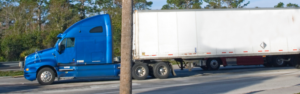 blue semi truck with trailer