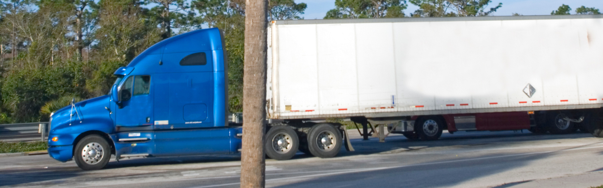 blue semi truck with trailer