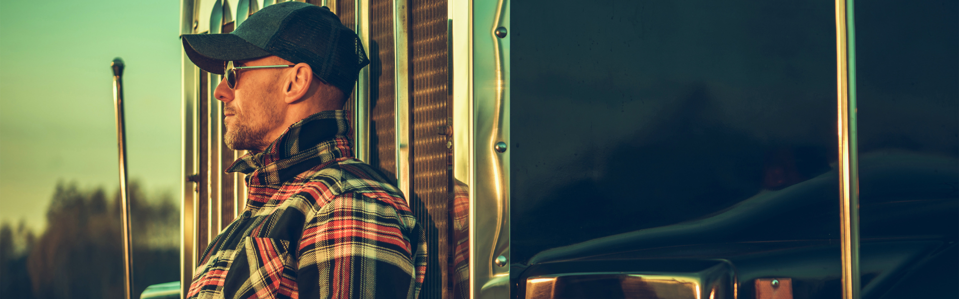 Man leaning against semi truck
