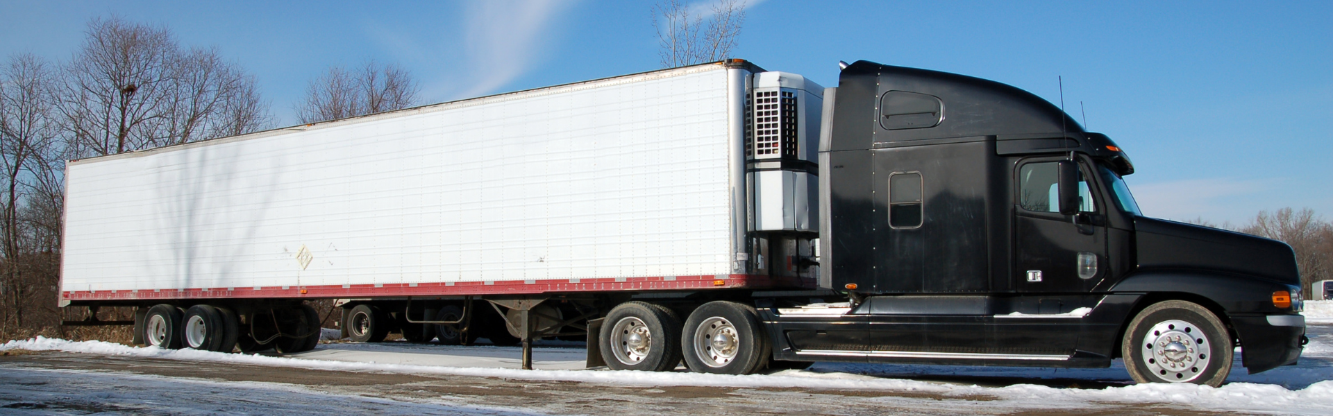 black semi truck with white trailer
