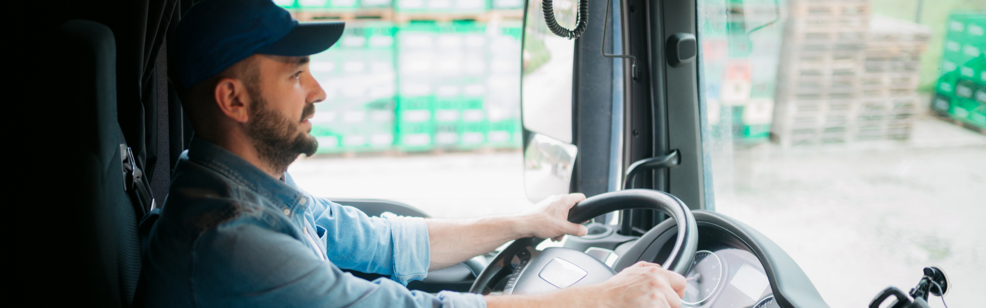 truck driver behind the wheel of semi truck