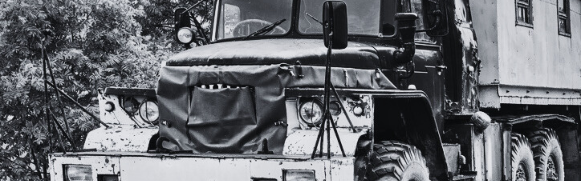 black and white photo of antique semi truck