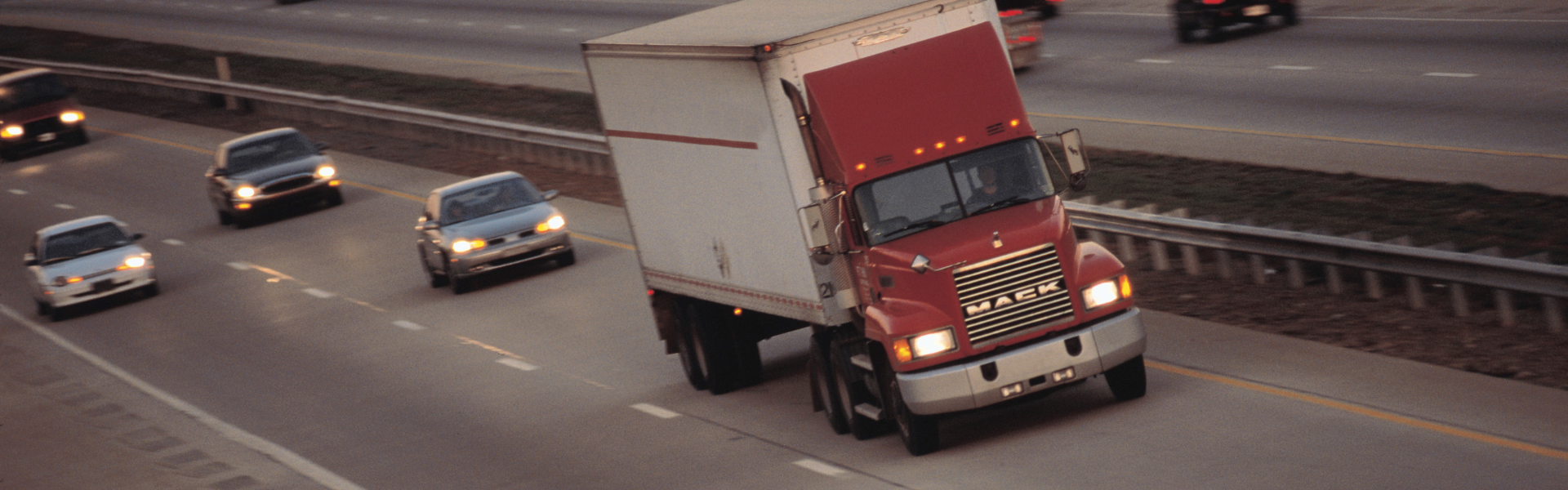 semi truck on highway with cars