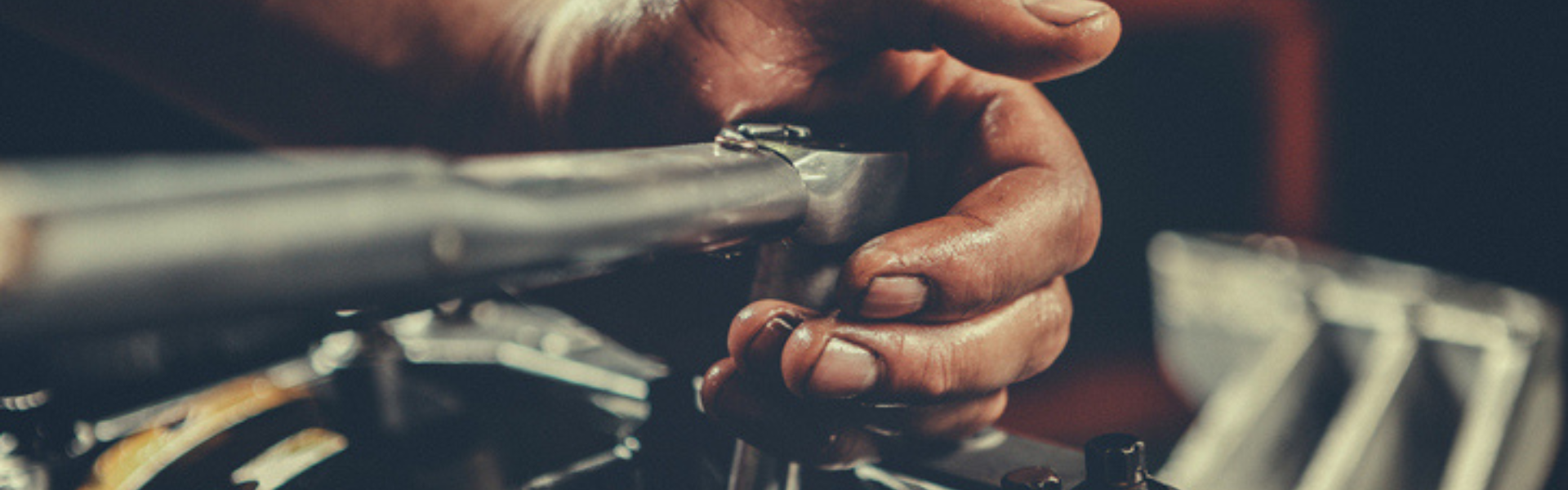 mechanic hand working on engine