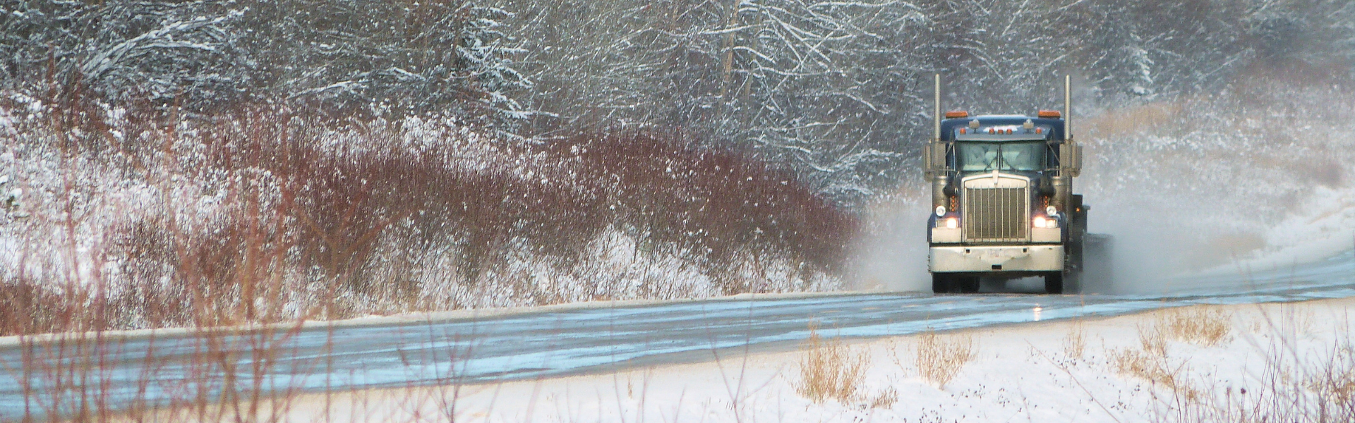 semi truck on snowy road