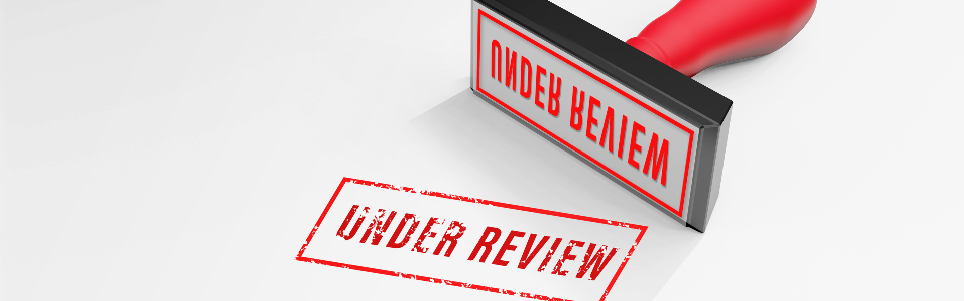 red "under review" stamp