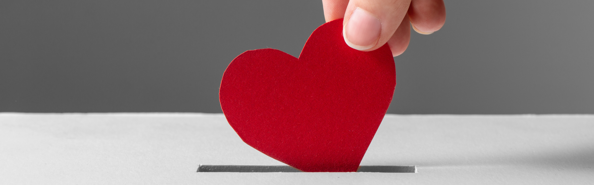 Placing paper heart in slot