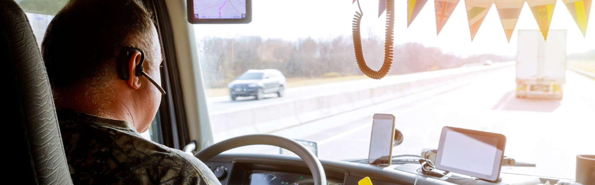 trucker in cab of semi truck
