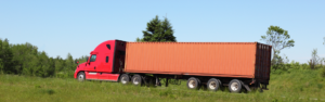red semi truck with orange trailer
