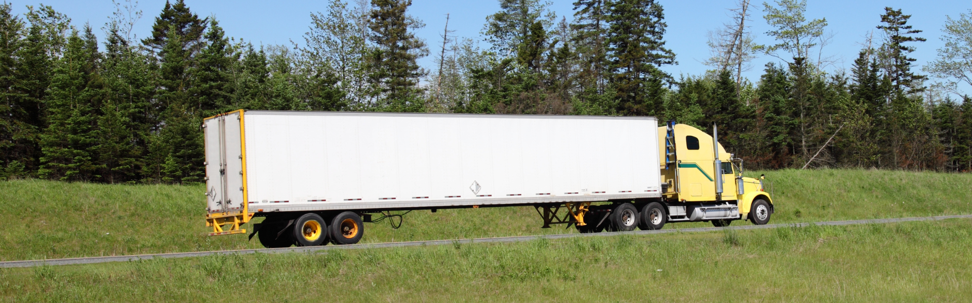 yellow semi with white trailer