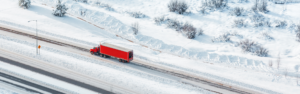 red semi truck on snowy road