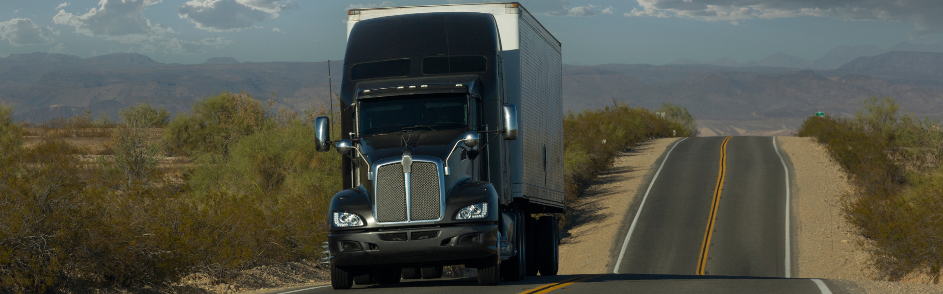 black semi truck on road