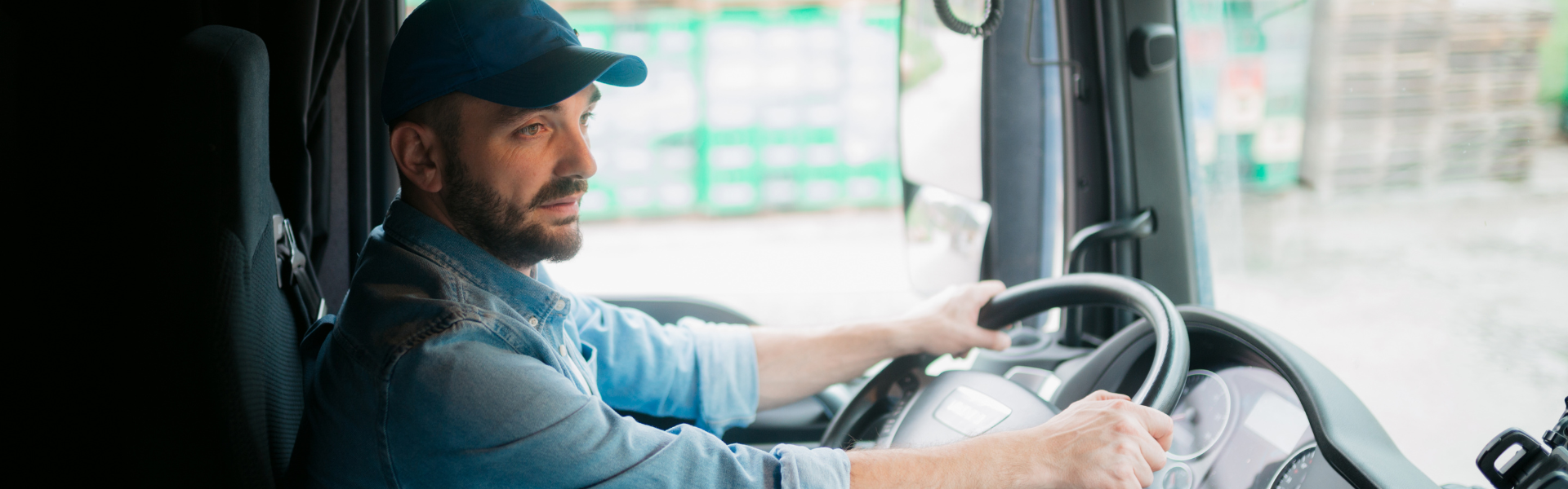 truck driver behind the wheel of semi truck