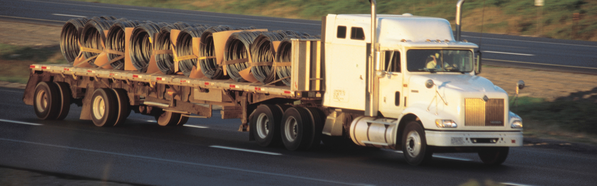 flatbed semi truck hauling coils