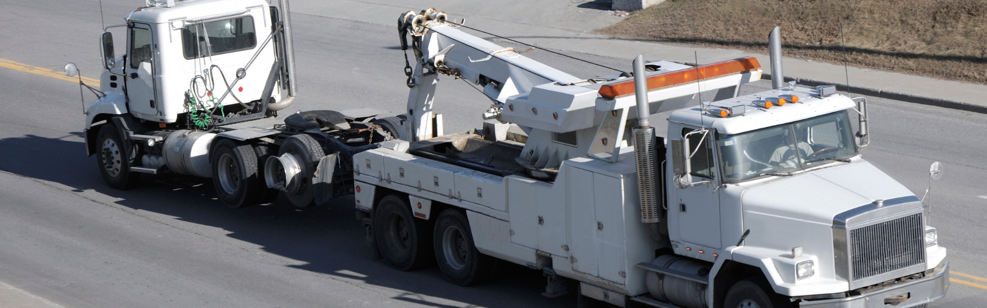 semi truck being towed