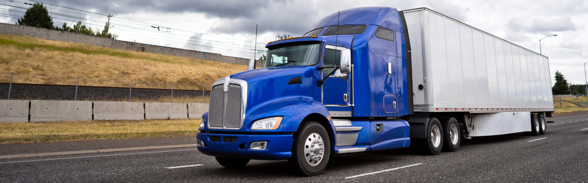 blue semi truck with underride guards